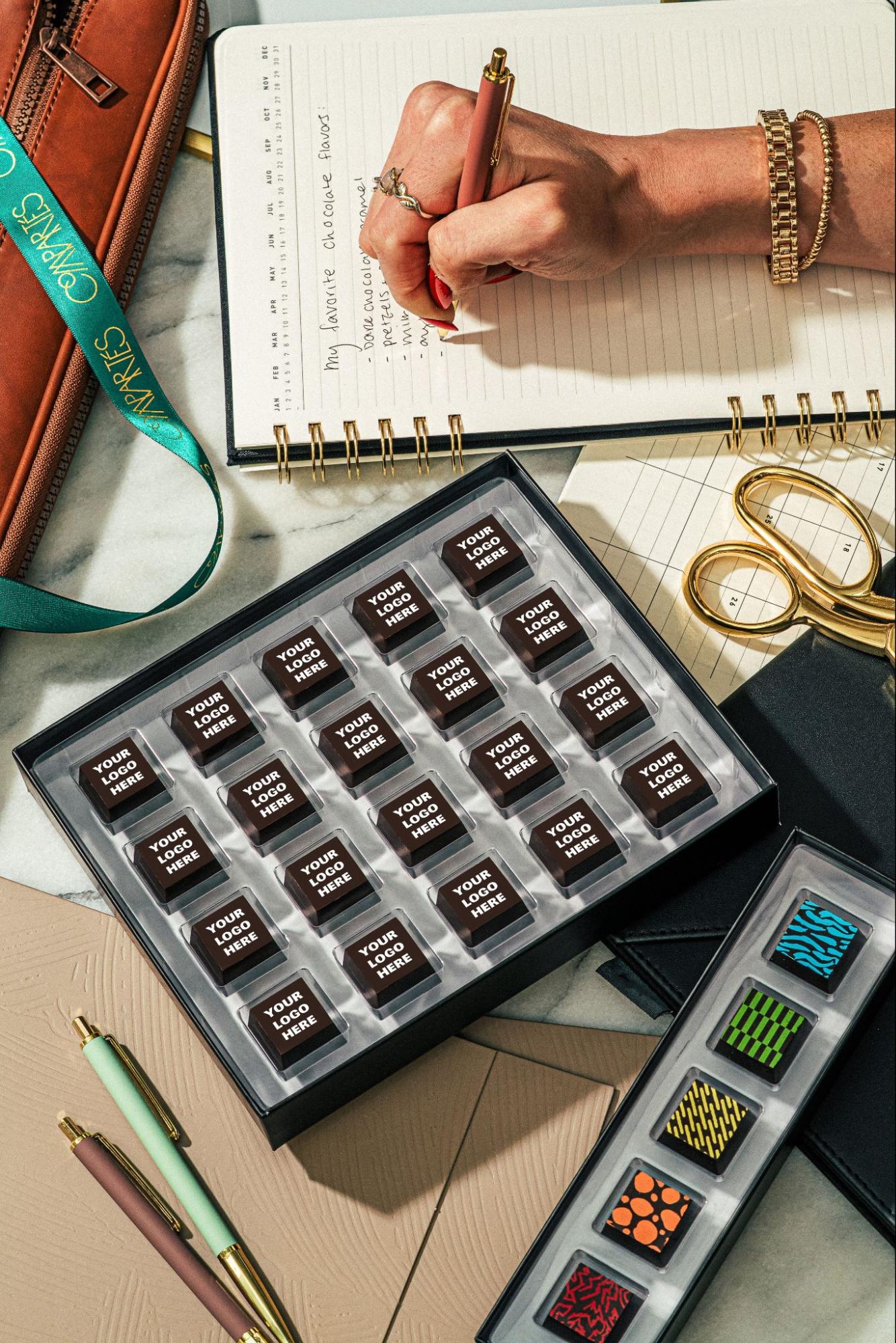 Custom corporate chocolate box on office desk—Compartés