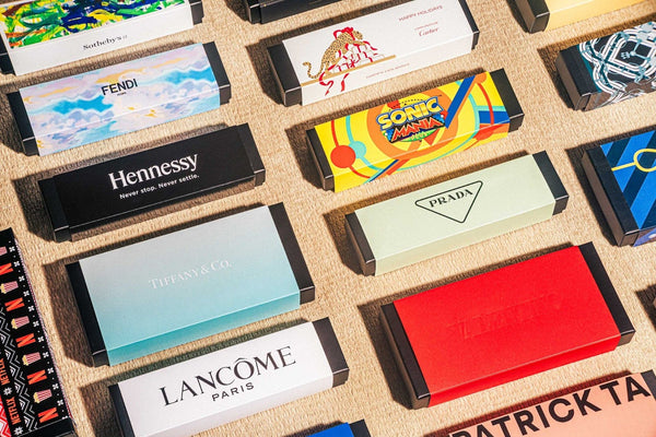 Multiple branded chocolate boxes spread across floor