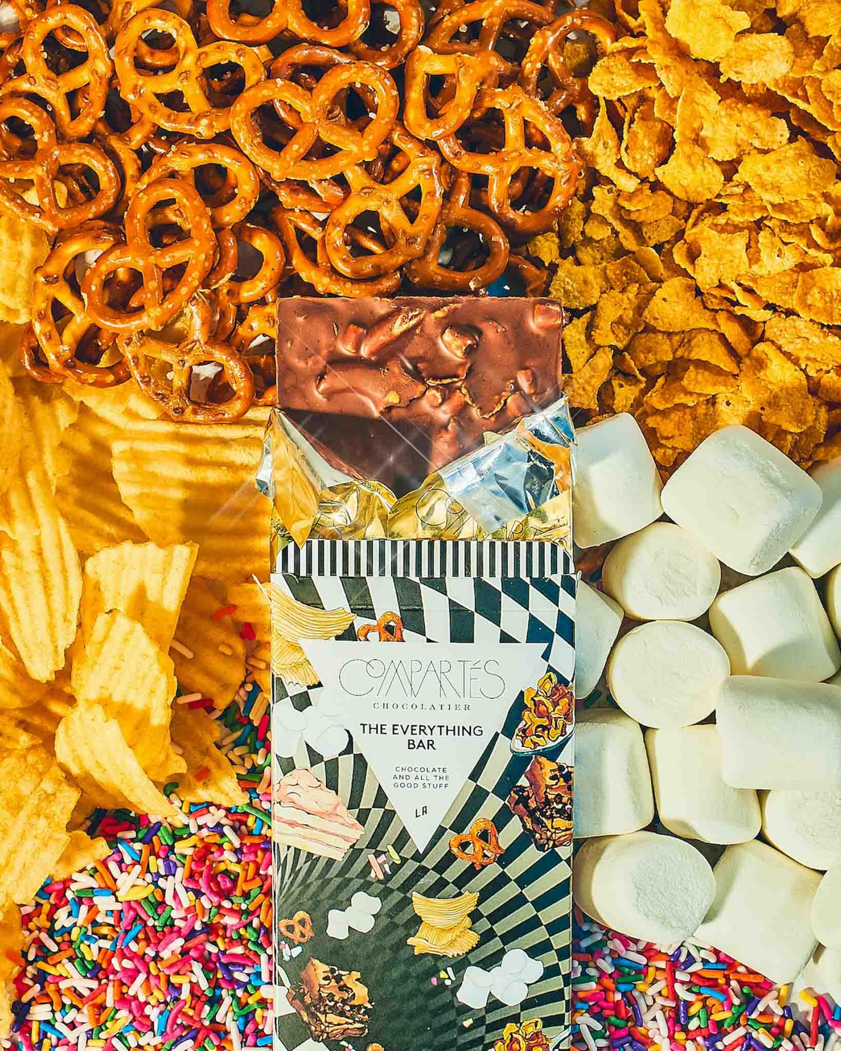 The Everything Bar with its ingredients in the background- Compartés