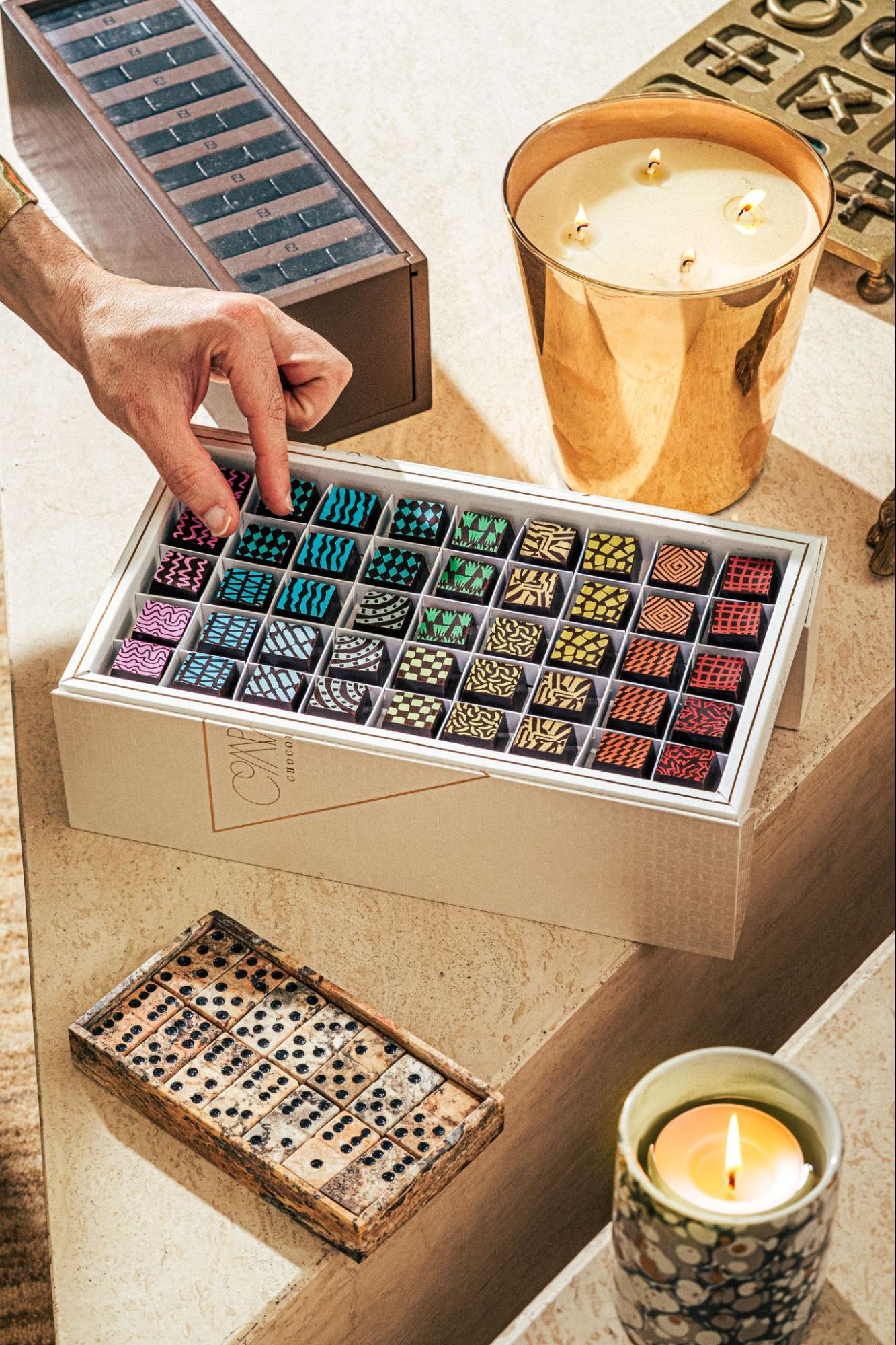 Luxurious white box of gourmet truffles on table — Compartés