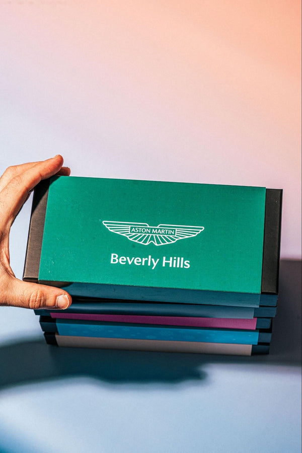 Multiple chocolate boxes stacked on top of each other—Compartés