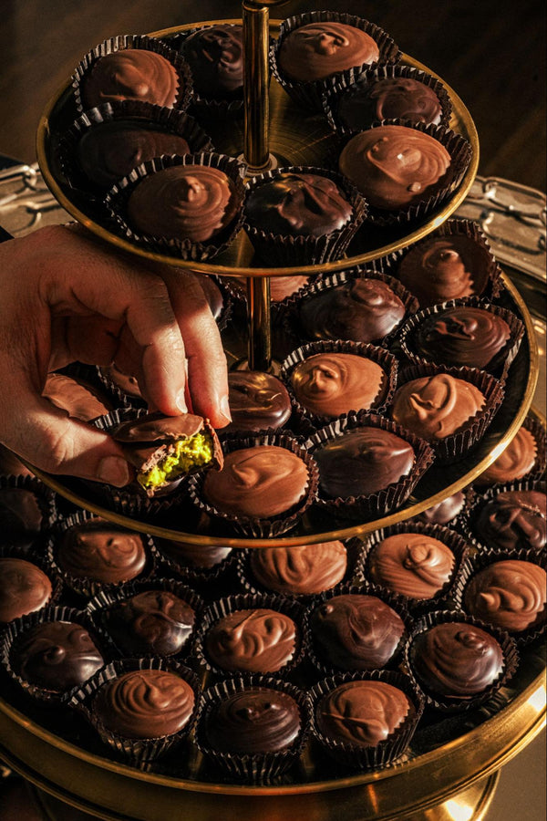 Dubai chocolate cups on tiered platter - Compartés