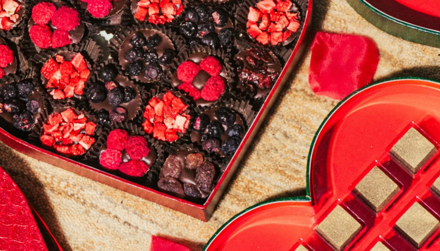 Banner image over Valentine's Day candy chocolate boxes