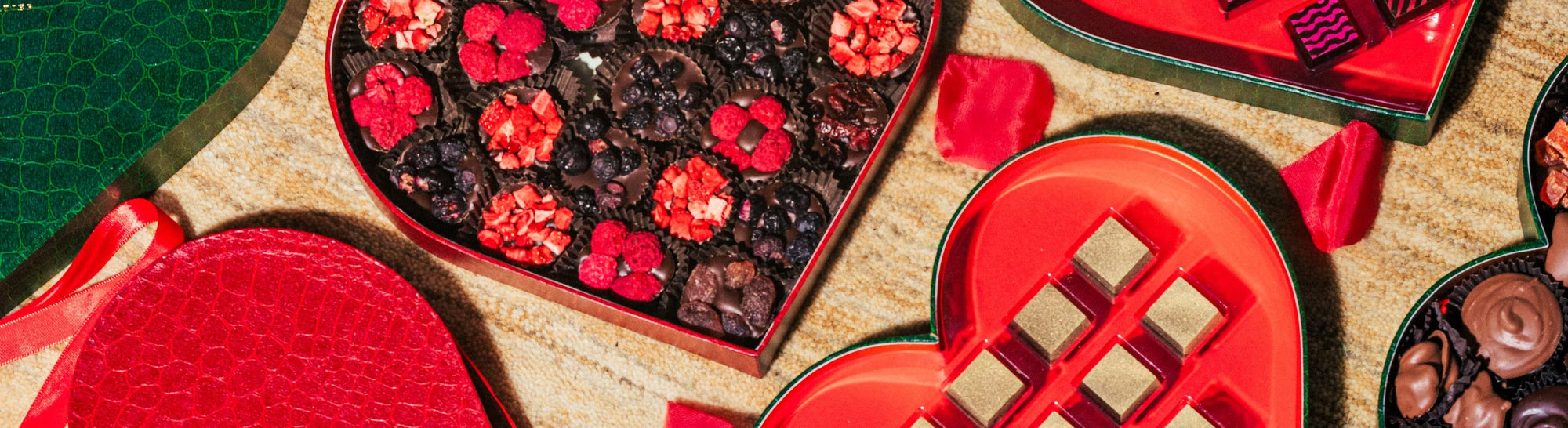 Banner image over Valentine's Day candy chocolate boxes