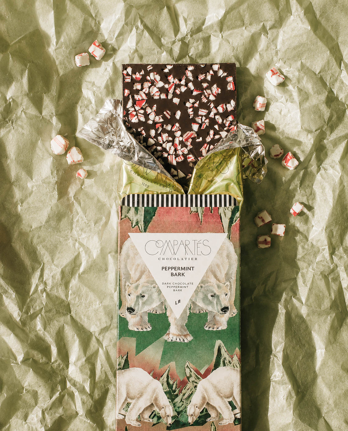 A Christmas Chocolate Bar of Peppermint Bark Dark Chocolate by Compartes Chocolatier Los Angeles. Gourmet Chocolate Peppermint Bark in a luxury chocolate gift box wrapped bar.