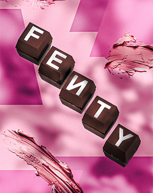 Fenty Beauty branded chocolates on a pink background