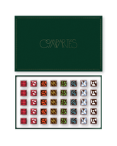 Compartes Christmas chocolates in a luxury deep green limited edition gift box, squares with plaid and animal motifs