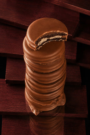 Milk Chocolate Covered Oreo Cookies hand dipped by Compartes Chocolatier Los Angeles in gourmet milk chocolate. 