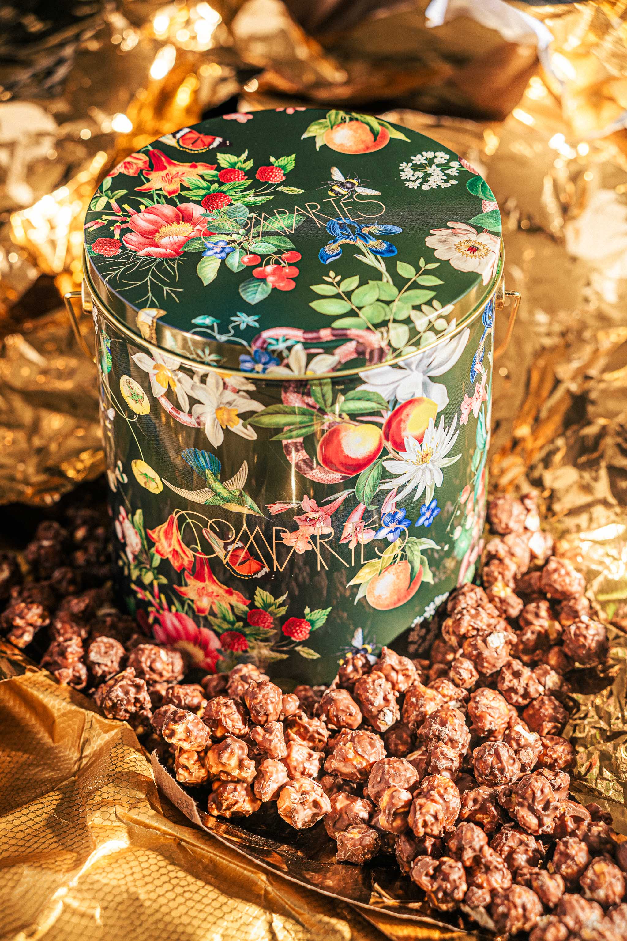 Person receiving box of chocolates wrapped in a bow