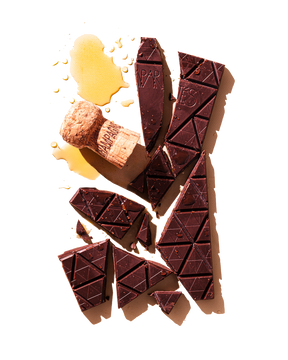 Compartes luxury champagne dark chocolate gift bar, with a cork and a pour of champagne
