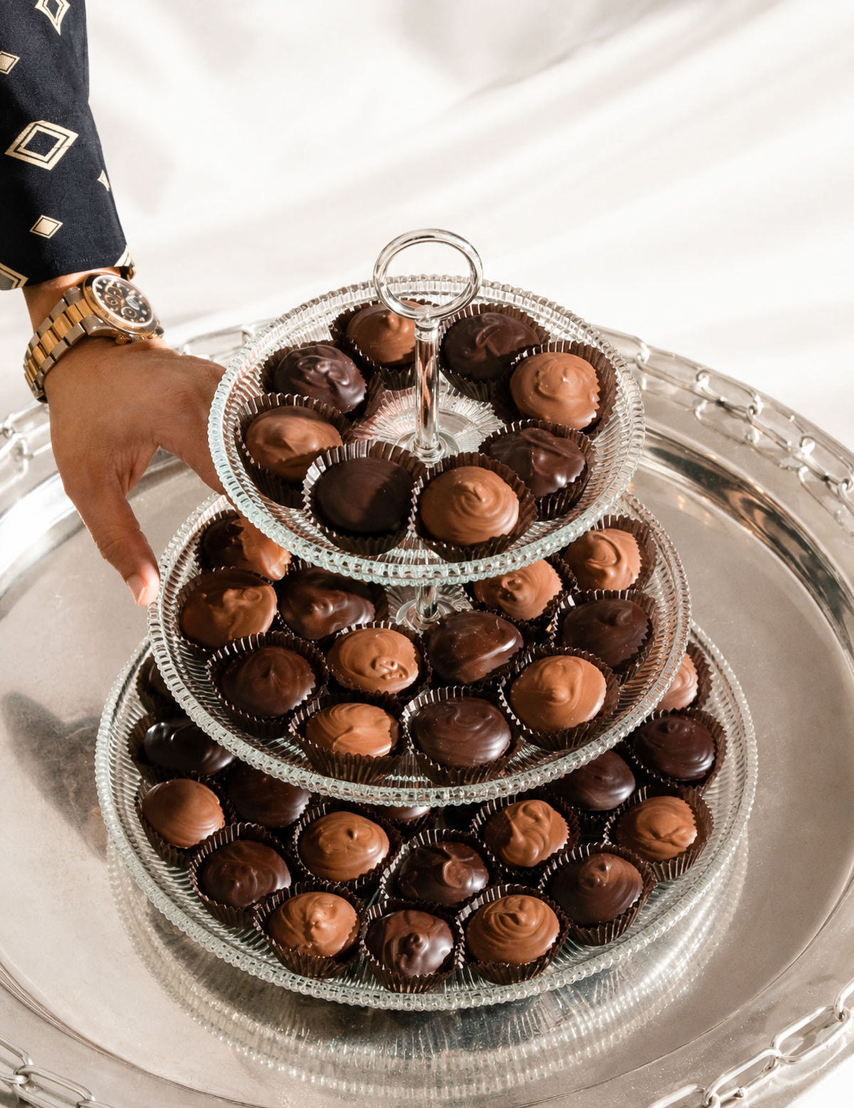 Gourmet Chocolate Peanut Butter Cups in a beautiful place setting. Luxury chocolates by Compartes Los Angeles.