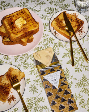 Gourmet Chocolate Bar Cinnamon Toast Holiday Chocolate Bar by Compartes Chocolates in a holiday tablescape.
