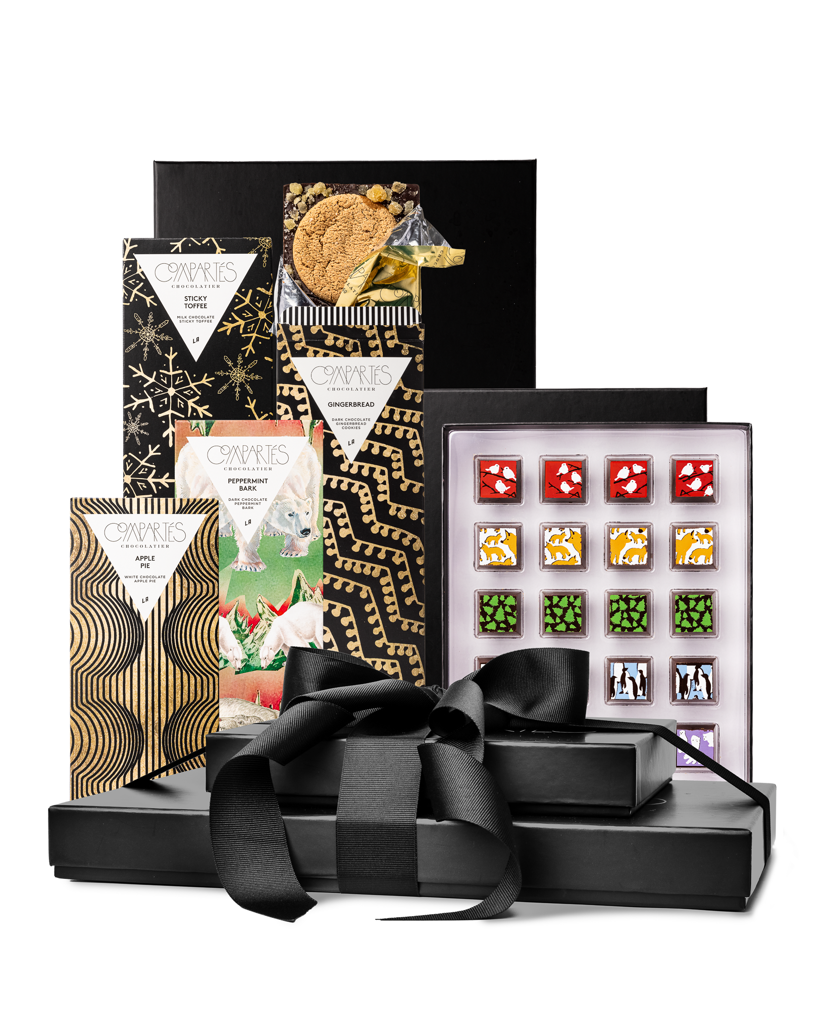 Compartes best Christmas chocolate gift tower, black boxes with a ribbon, gold snowflake bars and truffles