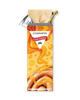 A partially unwrapped Compartés Little Debbie Honey Buns chocolate bar, showing the creamy beige chocolate filling and a gold foil seal, set against a plain white background.