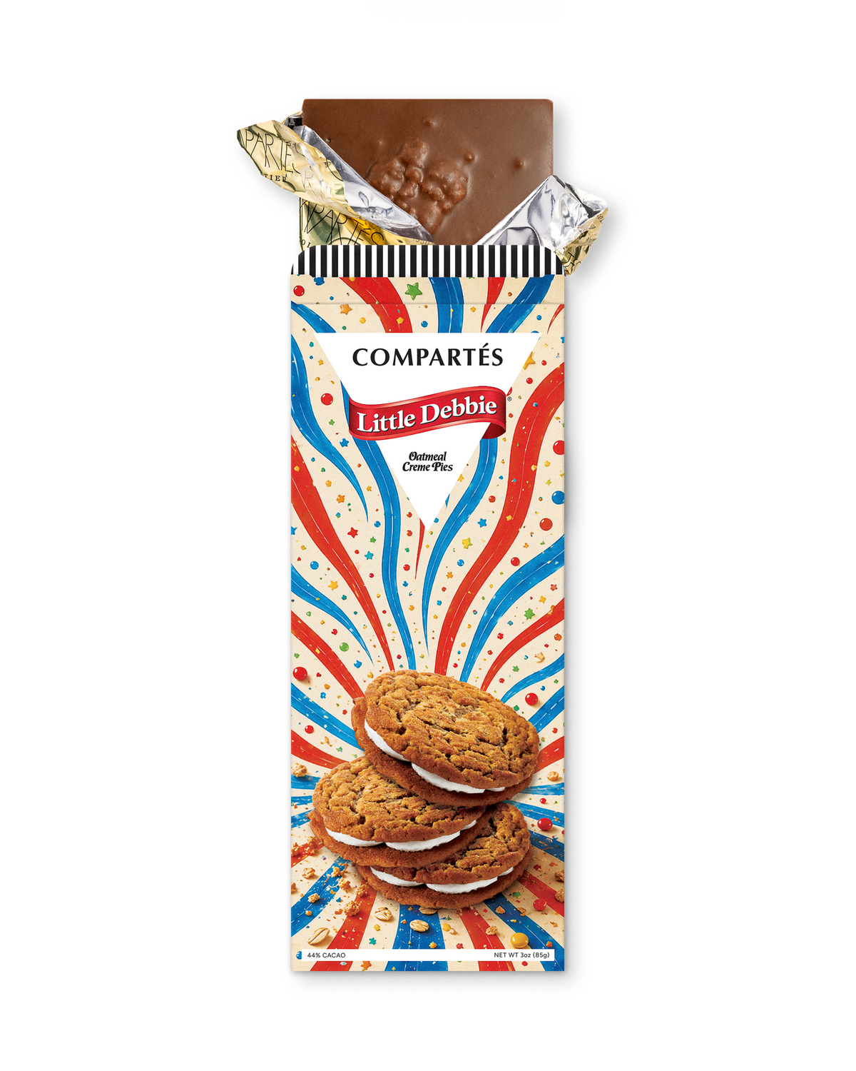 A Compérés Little Debbie oatmeal creme pies bar in its wrapper, with the top foil partially peeled back to reveal a piece of chocolate. The wrapper features a red, white, and blue burst design with an illustration of oatmeal creme pies.