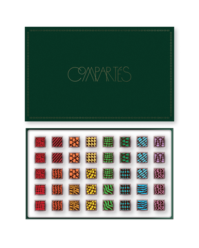 Compartes luxury signature chocolate truffles in a deep green gift box, squares in rich red, gold and green patterns
