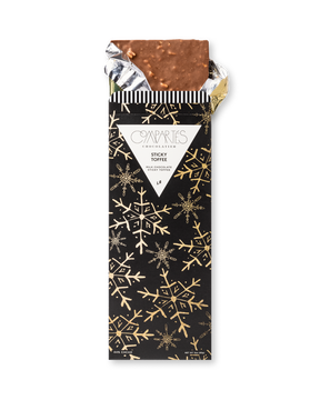 Compartes gourmet sticky toffee chocolate bar, milk chocolate in a black and gold snowflake wrapper, chocolate gift, date